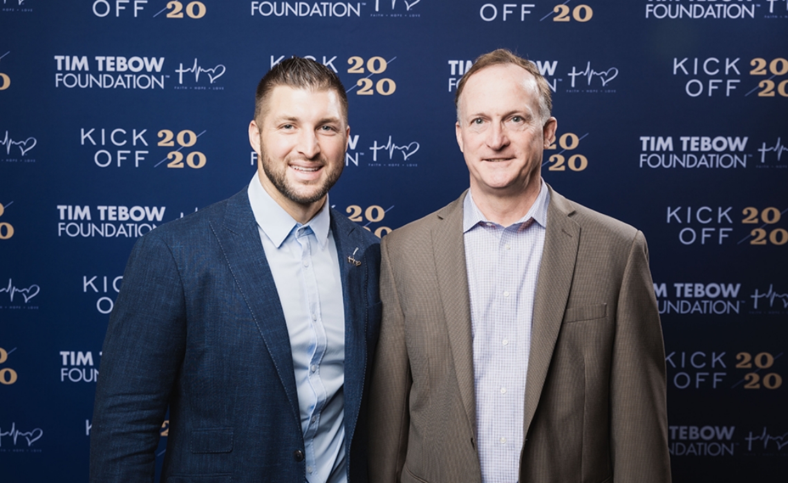 Photo of Larry Spoth with Tim Tebow